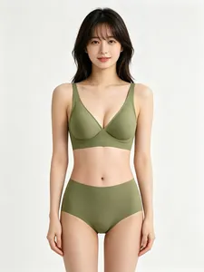 Professional model wearing seamless green jelly bra set on white background