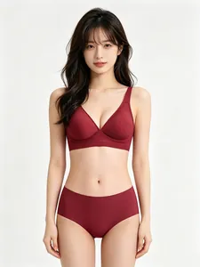 Detailed view of women's seamless deep red jelly bra and matching panty set on model