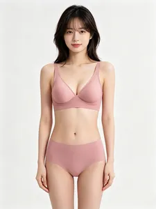 Front view of seamless jelly glue bra and panties set in dusty pink on model