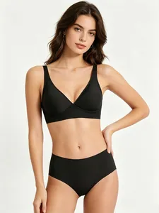 Close-up detail of a seamless black jelly bra set worn by a professional studio model