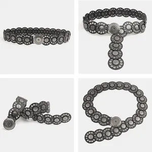 Gedetailleerde weergaven van een zwarte bohemian riem met vintage zilveren metalen details