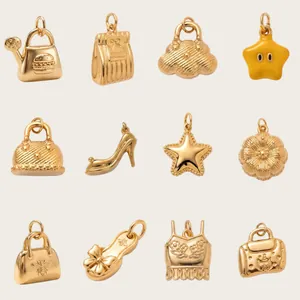 Macro detail view of various gold-plated stainless steel charms for DIY jewelry.