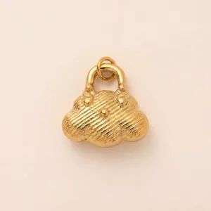 Macro view of detailed 18K gold plated stainless steel cloud bag shaped pendant for DIY jewelry