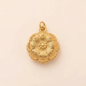 High-quality close-up of a golden stainless steel flower pendant with intricate textures