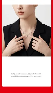 Elegantly designed 925 silver necklace featuring moissanite-studded star pendants on a model.