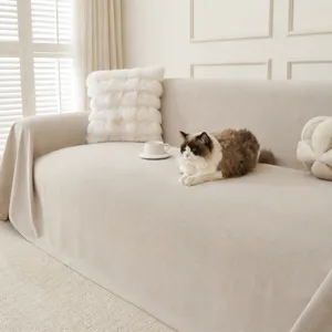 Detail view of a cream white water-repellent corduroy sofa throw with cozy texture