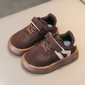 Brown children's soft-sole anti-slip sneakers with velcro and white M-pattern detail