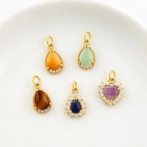 Five assorted 18K gold-plated teardrop and heart-shaped natural stone pendants