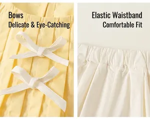 Dettaglio top giallo a pieghe con fiocchi e pantaloni bianchi con elastico