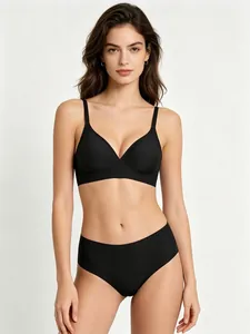 Detail of seamless black jelly bra and panty set on professional model.