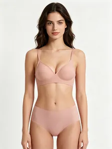 Seamless jelly bra set in nude pink shown on a model against white background