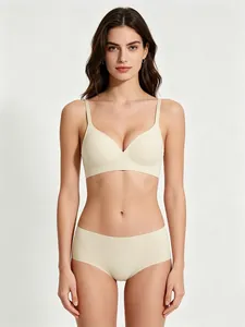 Elegant beige seamless bra and matching panty set for women with soft jelly support.