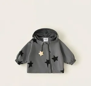 Grey hooded windbreaker jacket for girls with black star patterns for outdoor use