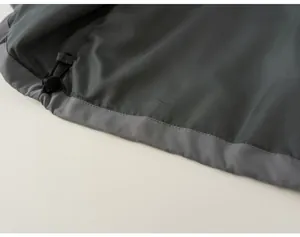 Close-up of adjustable drawstring hem on windproof girl's outdoor jacket
