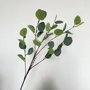 Detailed view of artificial eucalyptus branch with realistic silk-screened green leaves