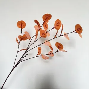 Detailed view of artificial orange eucalyptus branch with realistic silk-screened leaves