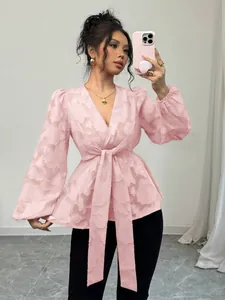 Elegant pink semi-transparent V-neck blouse with tie-waist and textured floral pattern