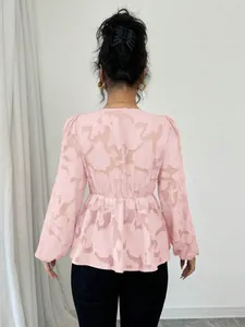 Back view of pink semi-transparent burnout blouse showing delicate floral jacquard texture