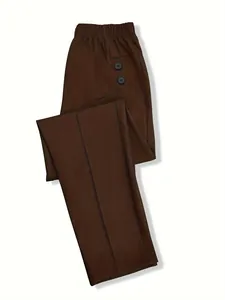 Detail view of these brown high-waisted trousers with elastic waist and side buttons