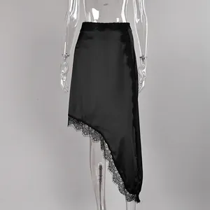 Close-up detail of a black asymmetrical satin skirt featuring delicate lace trim edging.