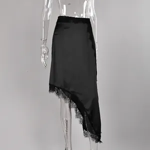 Detailed view of an elegant black asymmetric satin skirt with delicate lace trim.