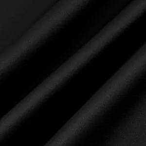 Macro detail of black satin fabric with smooth texture and subtle sheen
