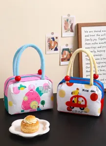 A detailed view showing two cute insulated lunch bags with colorful cartoon patterns.