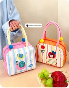 Detailed view of cute insulated lunch bags with colorful stripes and fruit patterns for kids