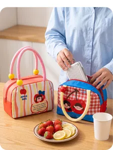 Detailed view of cute fruit theme insulated lunch bags with cherry and apple girl designs