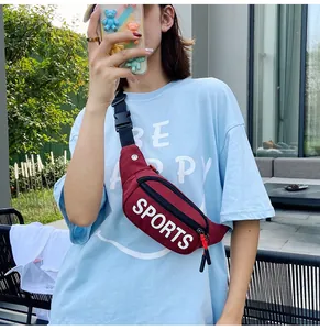 Women wearing a stylish burgundy fanny pack with SPORTS letter print outdoors