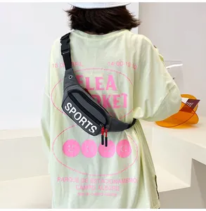 Dark grey sports crossbody chest bag with white letter print worn by model from behind