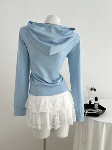 Rear view detail of a stylish light blue long-sleeved zip-up hooded sweatshirt for women.