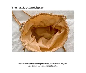 Interior view of straw woven handbag showing the yellow fabric lining detail