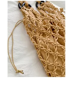 Detail shot of beige macrame hollow-out tote bag showing intricate woven texture and liner