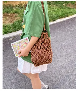 Detailed view of the intricate woven texture on this brown mesh shoulder bag