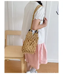 Vintage hand-woven macrame hollow-out shoulder bag with a drawstring inner pouch