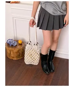 Vintage style cream macrame hollow-out shoulder bag with thick braided strap detail
