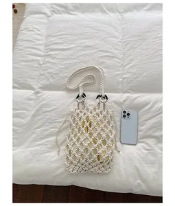 Elegant handmade cream macramé hollow-out tote bag with internal drawstring pouch