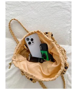 Internal capacity view of retro woven hollow-out shoulder bag with daily accessories