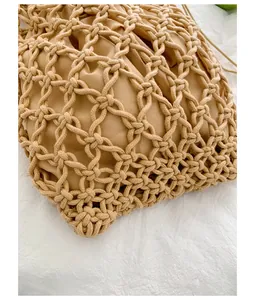 Detailed close-up showing the intricate beige hollow woven mesh texture of this retro bag