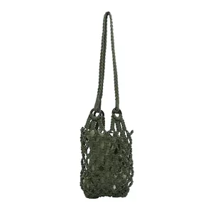 Vintage green macrame mesh shoulder bag featuring a matching fabric inner pouch