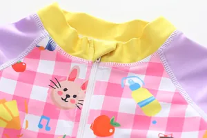 Close-up of the front zipper and cartoon bunny print on girls' one-piece swimsuit