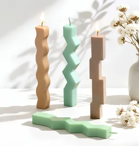 Detailed view of irregular geometric pillar candles with unique wavy and zigzag shapes