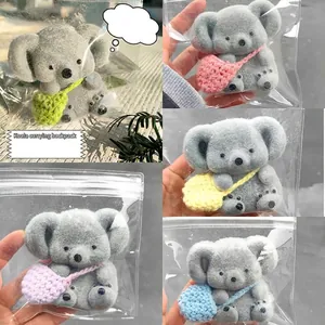 Grey flocked koala slow rebound squeeze toy with colorful mini knitted backpack