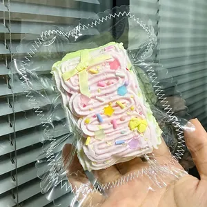 Detailed macro view of cute pink cream squishy toy inside vacuum-sealed packaging