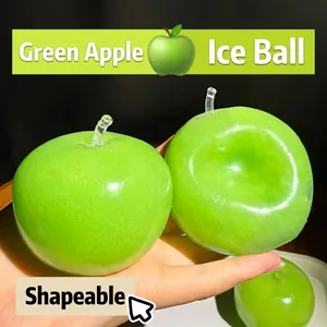 Detailed close-up showing the malleable texture of a realistic green apple squishy toy