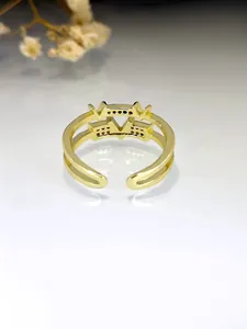 Close-up of a gold V-shaped ring inlaid with vibrant multi-colored zircon stones