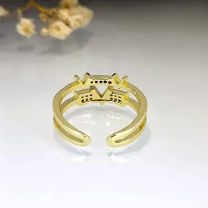 Elegant gold V-shaped open ring with colorful zircon stones for women.