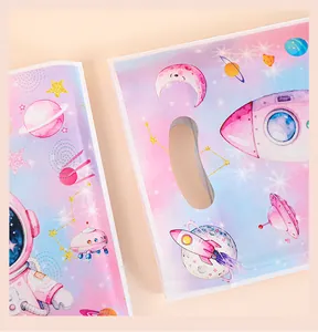 Detailed view of vibrant space astronaut prints on pearlescent film gift bags for kids