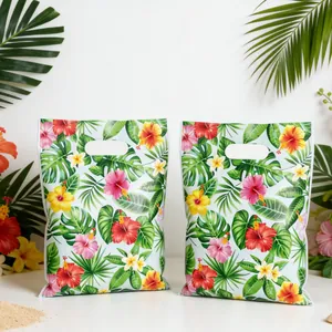 Tropical floral party gift bags with Hawaiian style hibiscus and leaf prints.